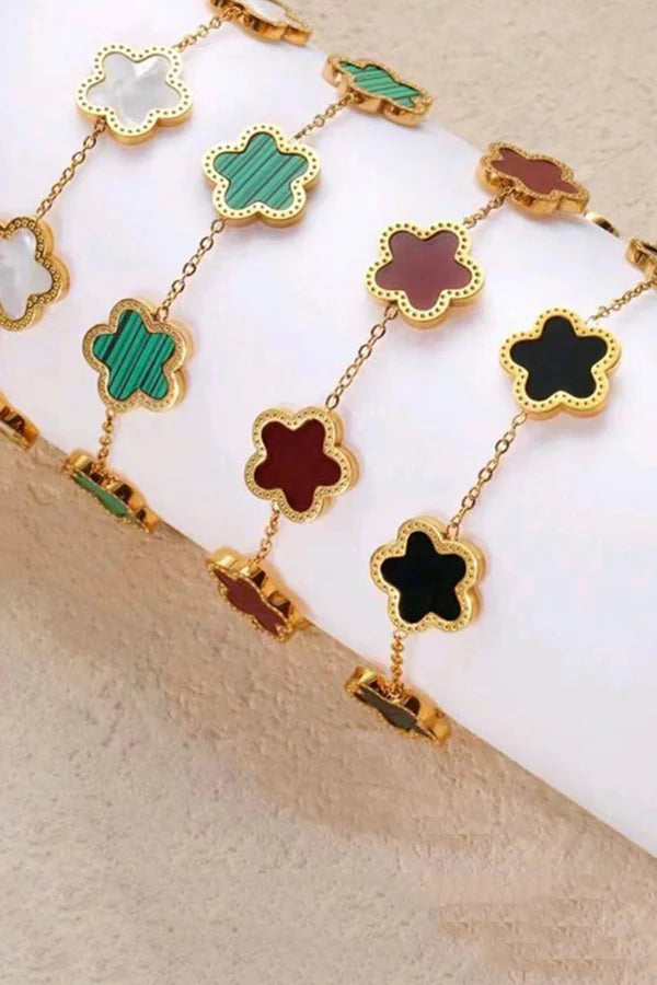 PULSERAS CON FORMA DE FLOR  EN ORO